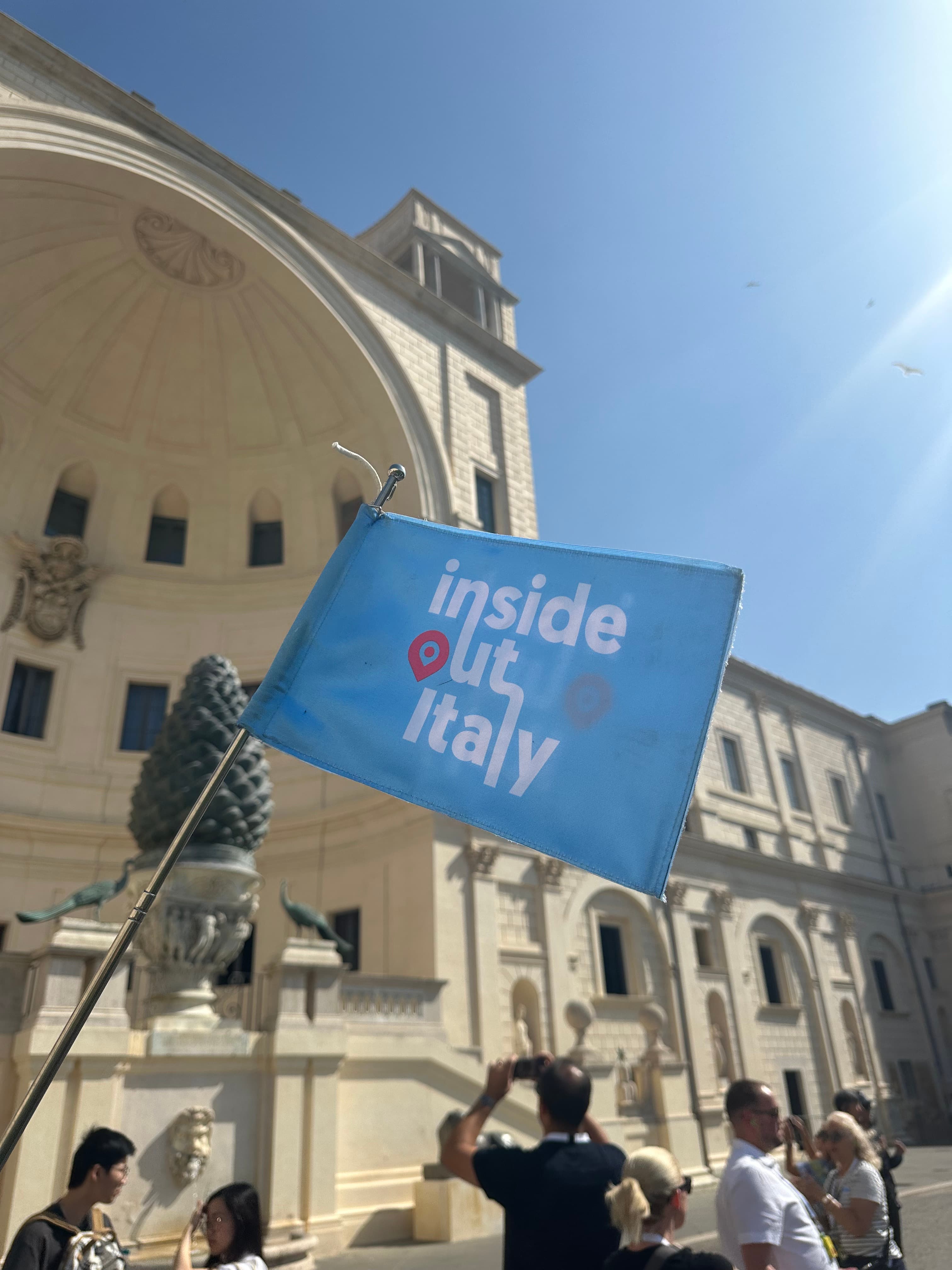 The Inside Out Italy flag in the Cortile della Pigna at the Vatican Museums